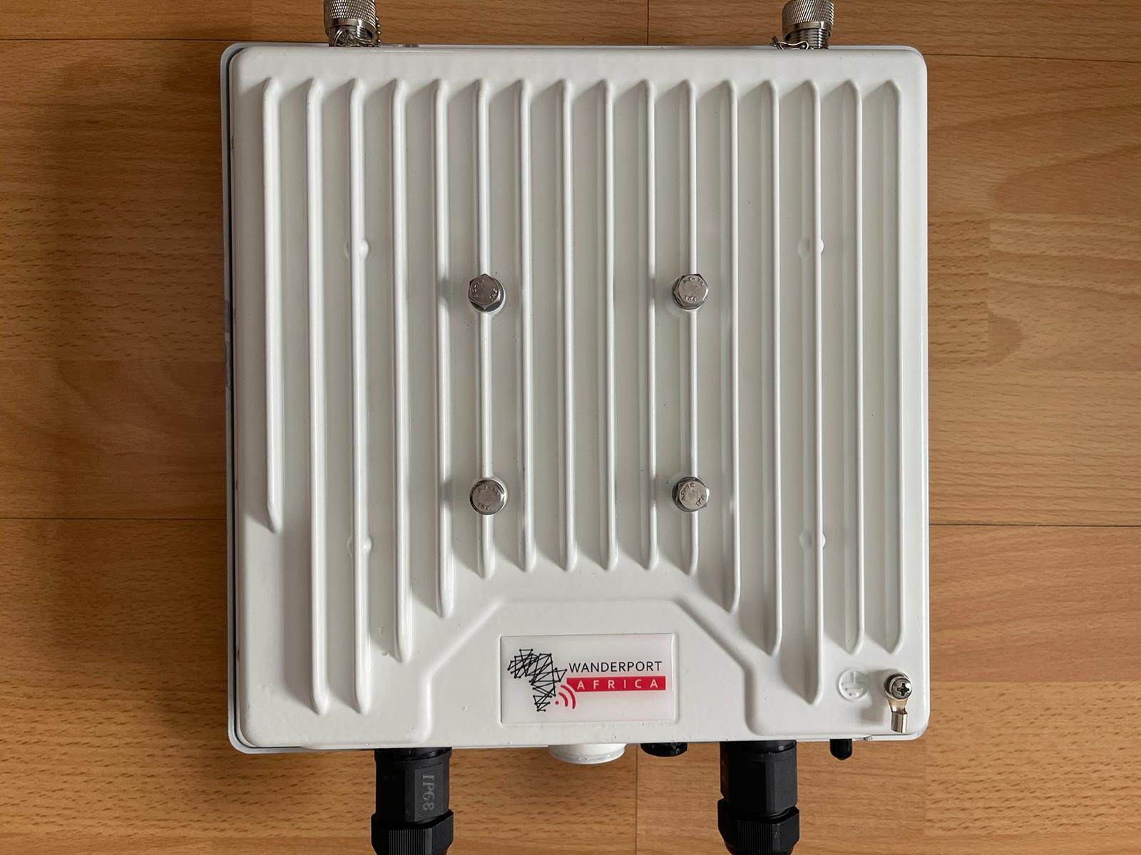 Outdoor UHF backhaul radio for shared rural network infrastructure